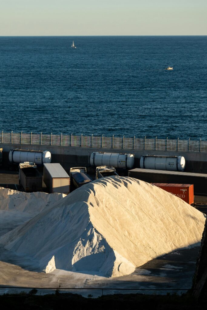 pexels photo 30036977 30036977 Seaside industrial area with salt piles and containers in Savona, Italy.