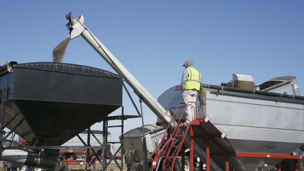 pexels photo 6867424 6867424 1 An industrial worker managing a machine outdoors on a clear day
